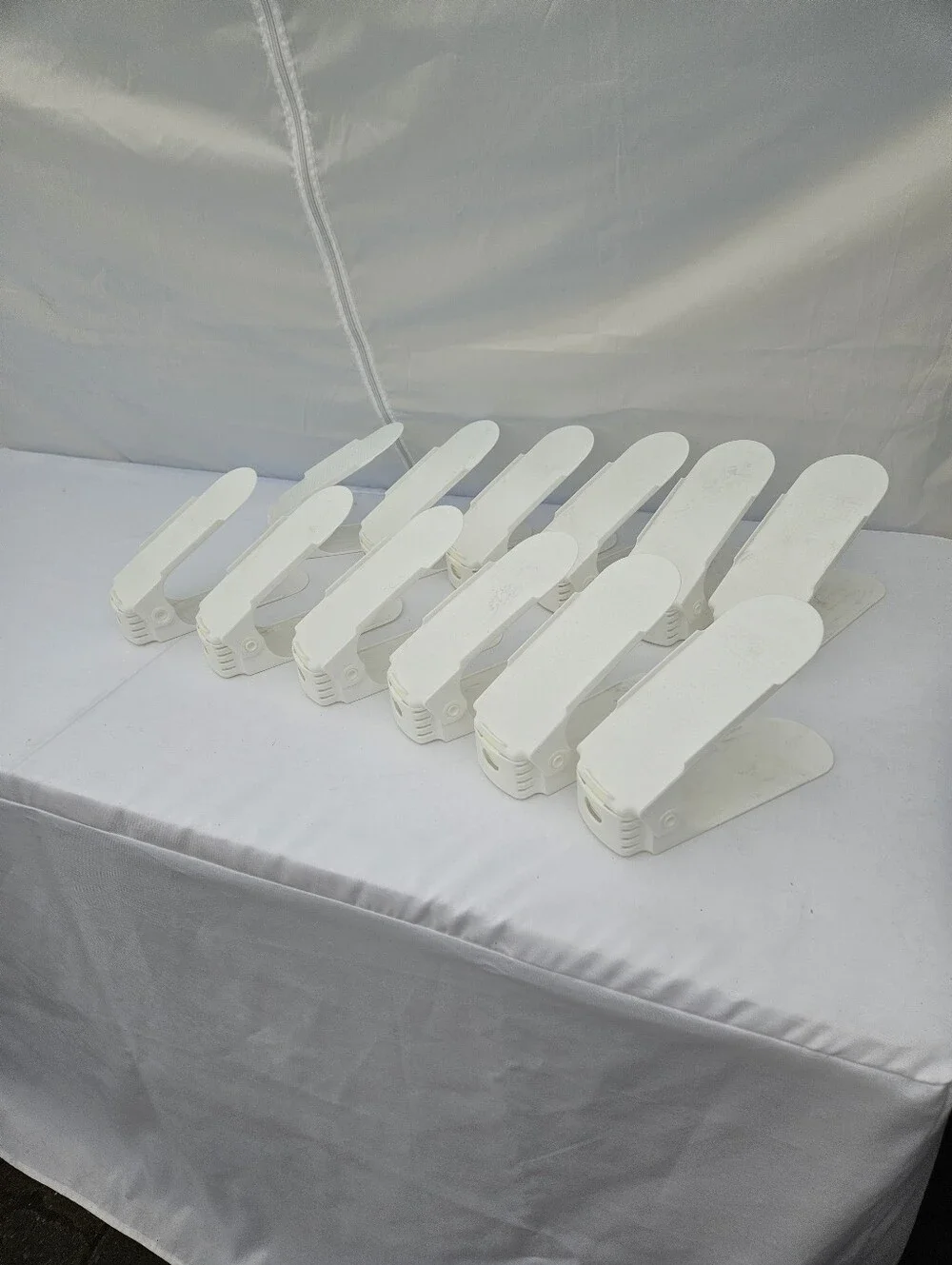 12 White plastic shoe organizers for closets